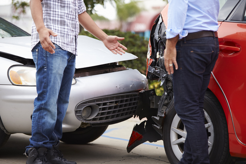 Minor car accident scene with insurance adjusters