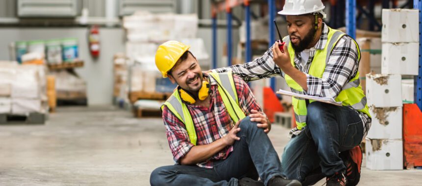 Injured worker consulting with a workers' compensation attorney about filing a claim