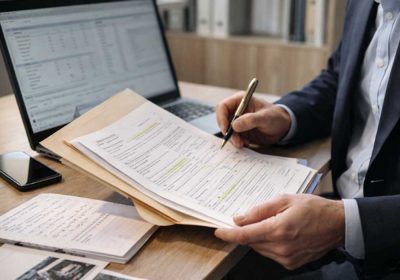 Georgia workers’ compensation settlement paperwork with pen