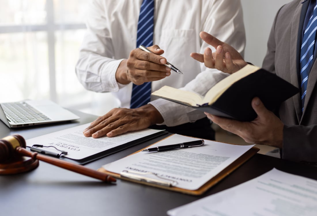 Attorneys reviewing truck accident liability documents