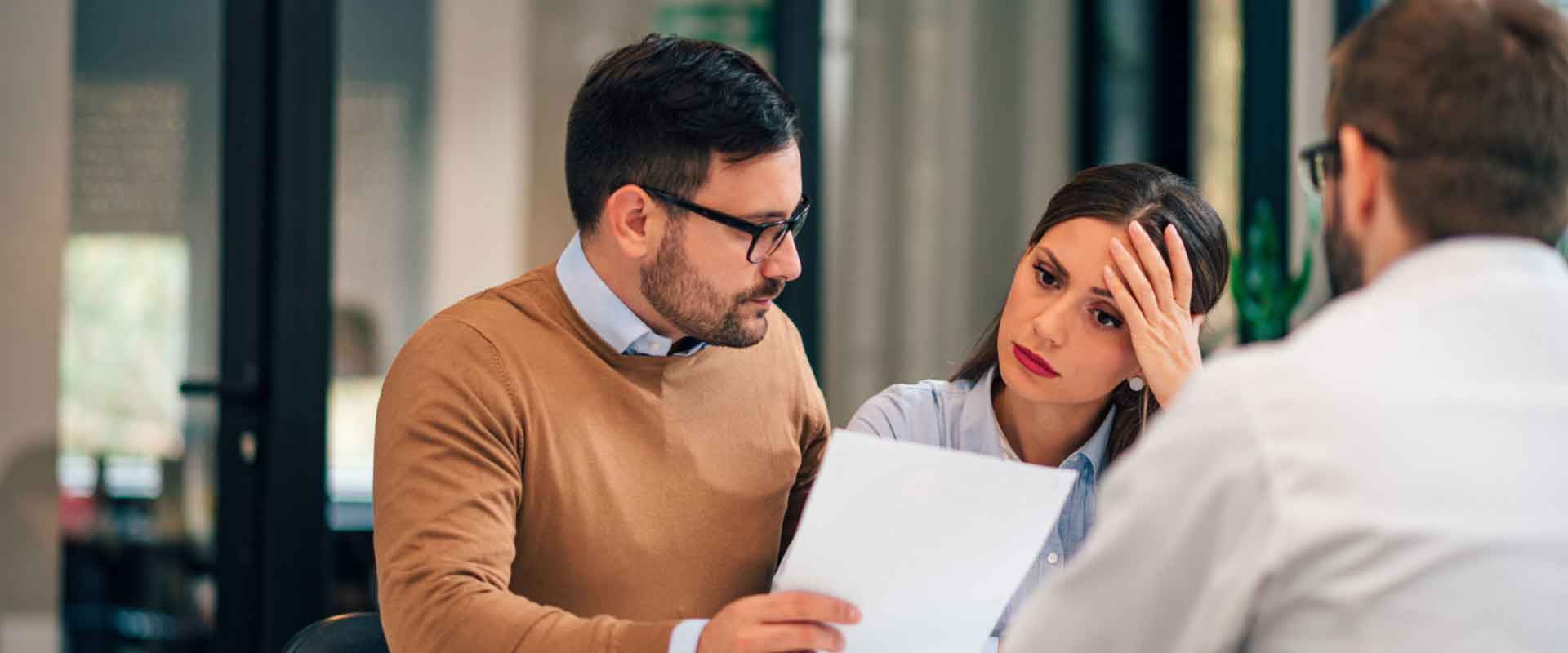 Personal injury lawyer meeting with clients to discuss accident case and legal options