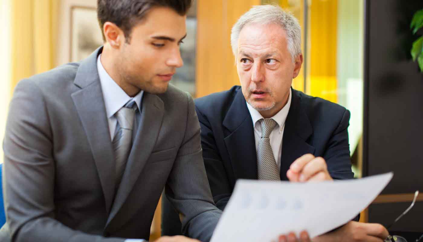 Wrongful death attorney reviewing case documents with client