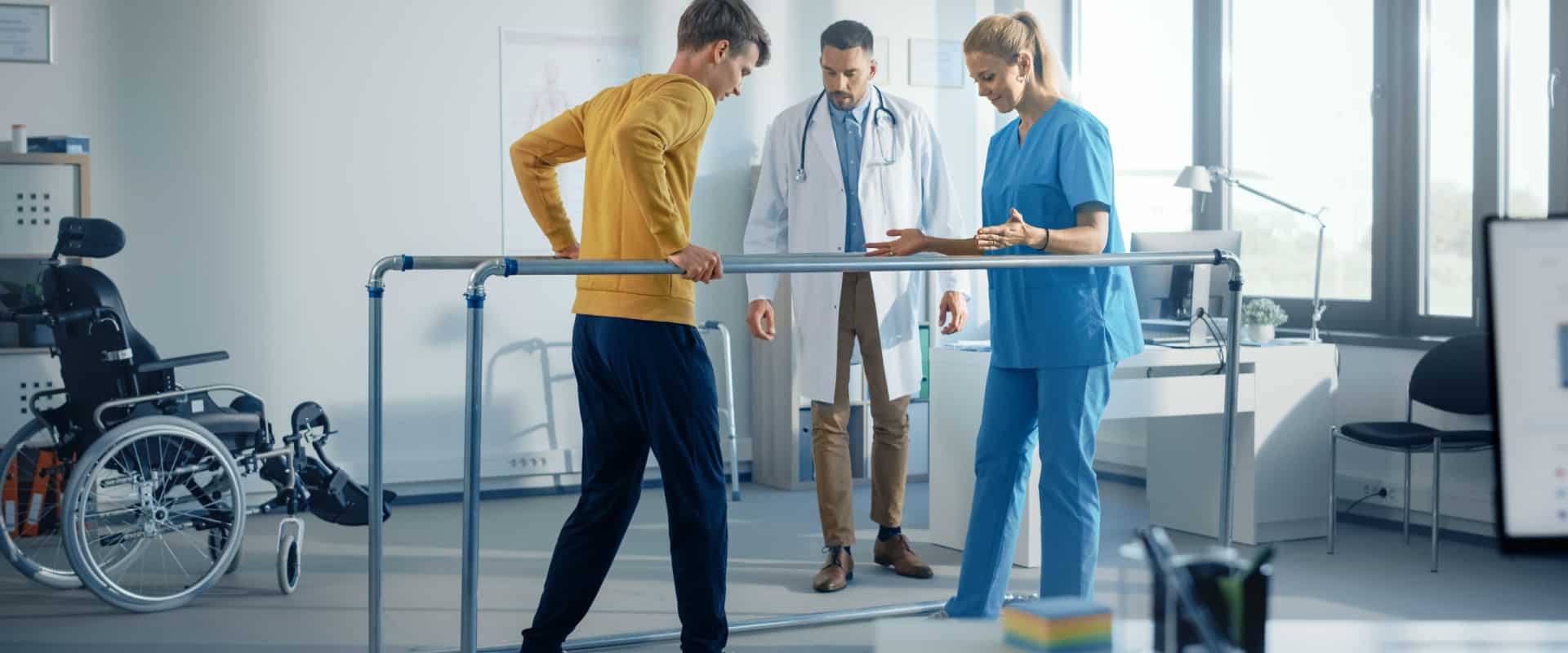 Patient undergoing spinal cord injury rehabilitation with medical team assistance in Georgia