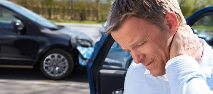 Driver holding neck after rear-end accident in Georgia